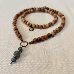 Long necklace of light brown olive wood, grey labradorite and blue kyanite beads